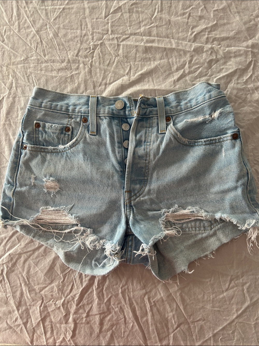 Levi’s 501 Light Blue Distressed Button-Fly Denim Shorts